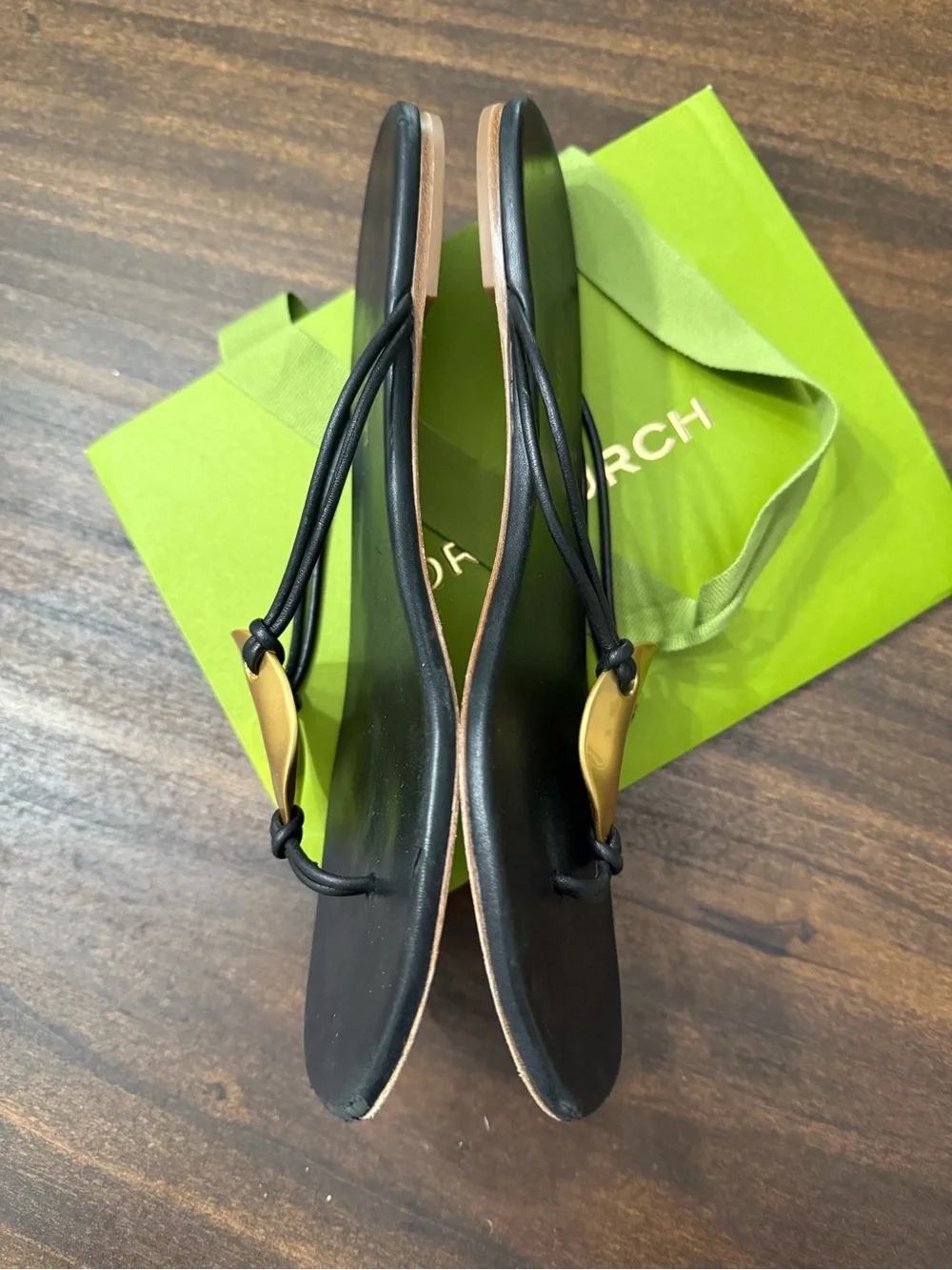 Tory Burch Patos Disk Leather Thong Sandals in black with gold-tone medallions
